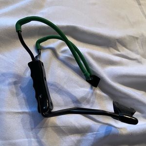 Metal slingshot with wrist support.